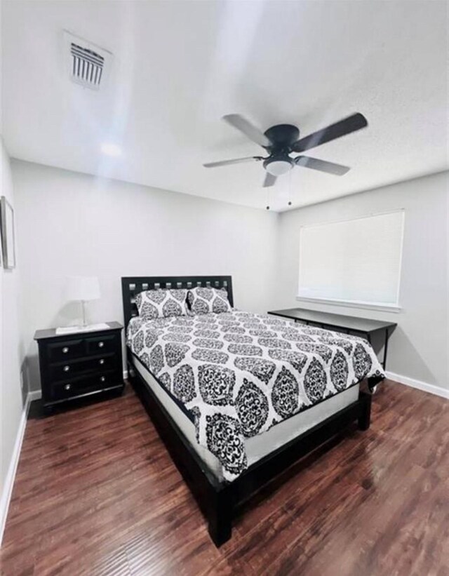 2112 Greenbriar Colony Dr, Houston, TX 77032 - bedroom with baseboards, wood finished floors, and a ceiling fan