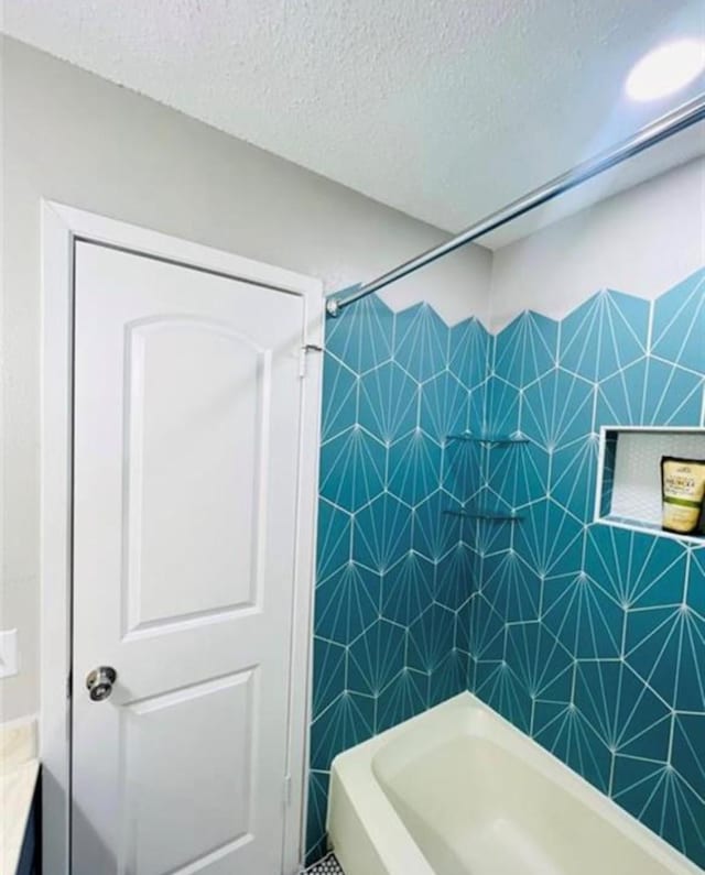 2112 Greenbriar Colony Dr, Houston, TX 77032 - full bathroom with a textured ceiling and shower / washtub combination