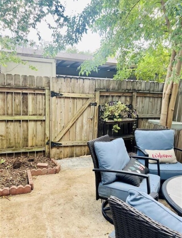 2112 Greenbriar Colony Dr, Houston, TX 77032 - view of patio / terrace featuring a gate and fence