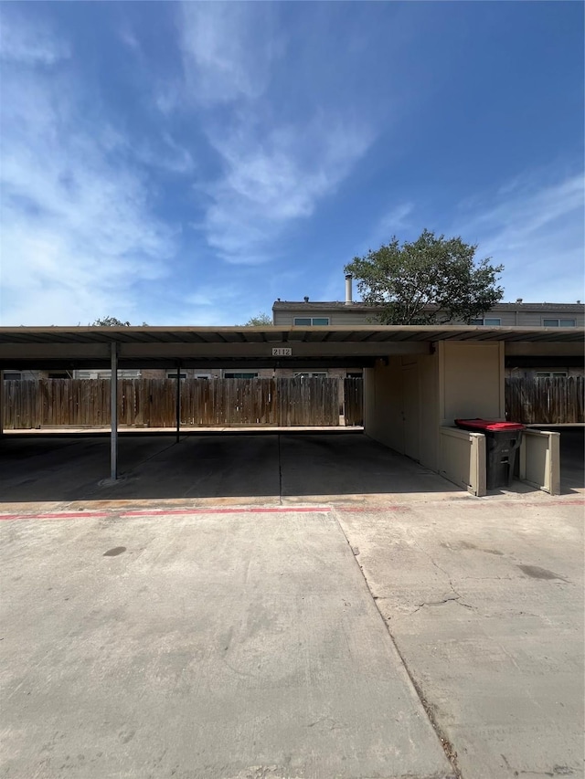 2112 Greenbriar Colony Dr, Houston, TX 77032 - covered parking lot featuring fence