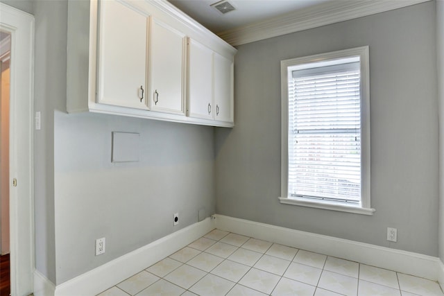 2709 Blodgett St, Houston, TX 77004 - washroom with electric dryer hookup, cabinet space, and light tile patterned floors