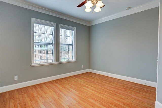 2709 Blodgett St, Houston, TX 77004 - spare room with healthy amount of natural light, light wood-style floors, a ceiling fan, baseboards, and crown molding