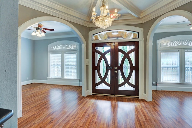 2709 Blodgett St, Houston, TX 77004 - entrance foyer with a ceiling fan, arched walkways, healthy amount of natural light, wood finished floors, and crown molding