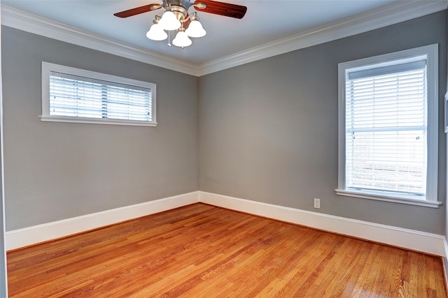 2709 Blodgett St, Houston, TX 77004 - spare room featuring light wood-type flooring, ceiling fan, baseboards, and ornamental molding
