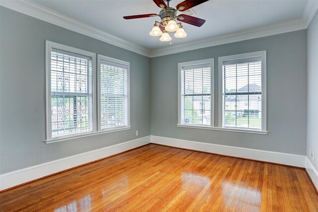 2709 Blodgett St, Houston, TX 77004 - spare room with healthy amount of natural light, light wood finished floors, ceiling fan, and ornamental molding