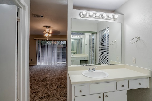 12210 Innsbruk Ct, Houston, TX 77066 - bathroom featuring a ceiling fan and vanity
