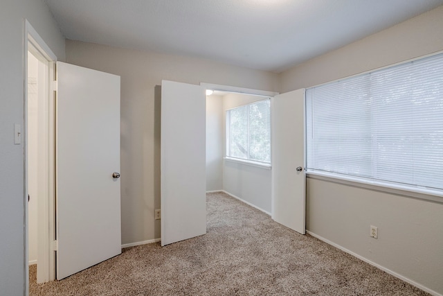 12210 Innsbruk Ct, Houston, TX 77066 - unfurnished bedroom featuring carpet flooring and baseboards