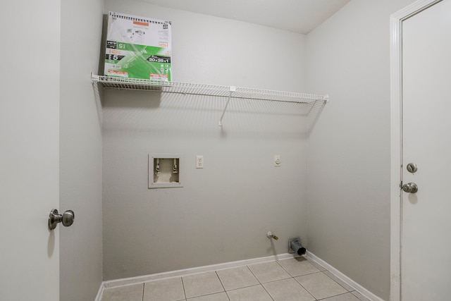 12210 Innsbruk Ct, Houston, TX 77066 - washroom with baseboards, light tile patterned flooring, washer hookup, hookup for a gas dryer, and hookup for an electric dryer