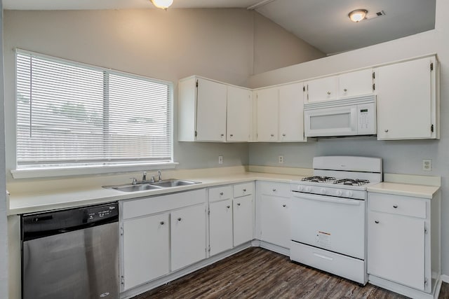 12210 Innsbruk Ct, Houston, TX 77066 - kitchen featuring white appliances, a sink, lofted ceiling, white cabinetry, and dark wood finished floors