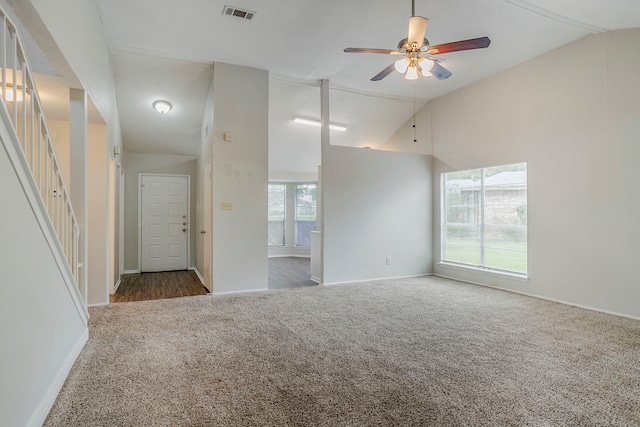 12210 Innsbruk Ct, Houston, TX 77066 - carpeted spare room featuring a ceiling fan, baseboards, high vaulted ceiling, and stairway