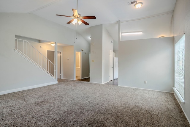 12210 Innsbruk Ct, Houston, TX 77066 - unfurnished living room featuring lofted ceiling, carpet floors, ceiling fan, stairs, and baseboards