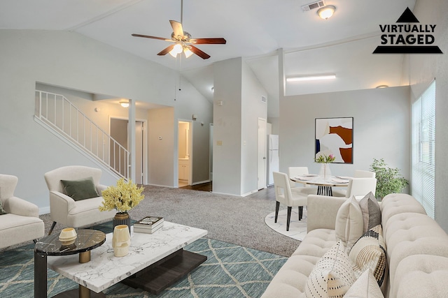 12210 Innsbruk Ct, Houston, TX 77066 - living room featuring vaulted ceiling, stairs, a ceiling fan, and baseboards