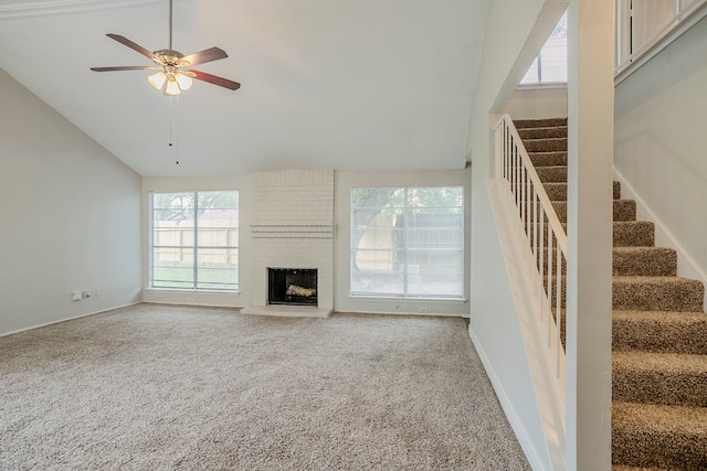 12210 Innsbruk Ct, Houston, TX 77066 - unfurnished living room with plenty of natural light, ceiling fan, carpet flooring, stairs, and high vaulted ceiling