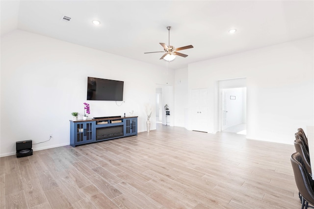7111 Hillside Ave, Baytown, TX 77523 - unfurnished living room with ceiling fan, light wood-style floors, and recessed lighting