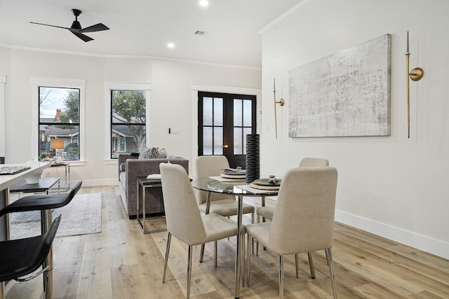 2611 Morrison St, Houston, TX 77009 - dining area with crown molding, baseboards, a ceiling fan, light wood finished floors, and recessed lighting