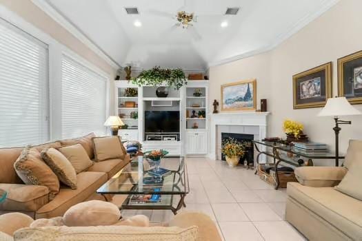 2 Argonne Pl, The Woodlands, TX 77382 - living room with tile patterned flooring, a fireplace, plenty of natural light, recessed lighting, and ornamental molding