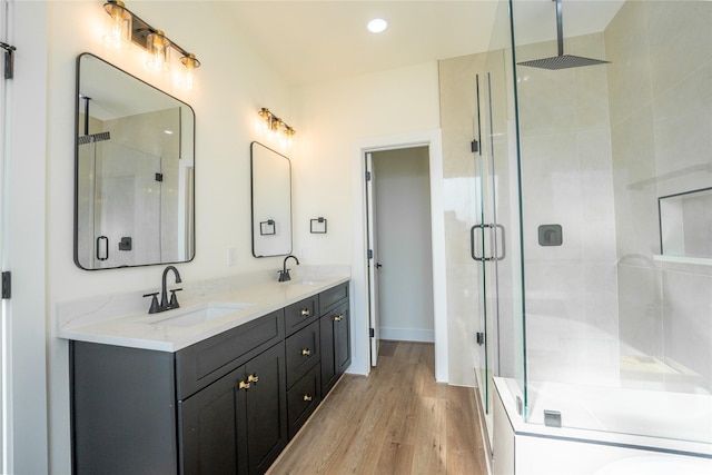 4111 Dreyfus St, Houston, TX 77021 - full bathroom featuring a stall shower, double vanity, wood finished floors, and recessed lighting
