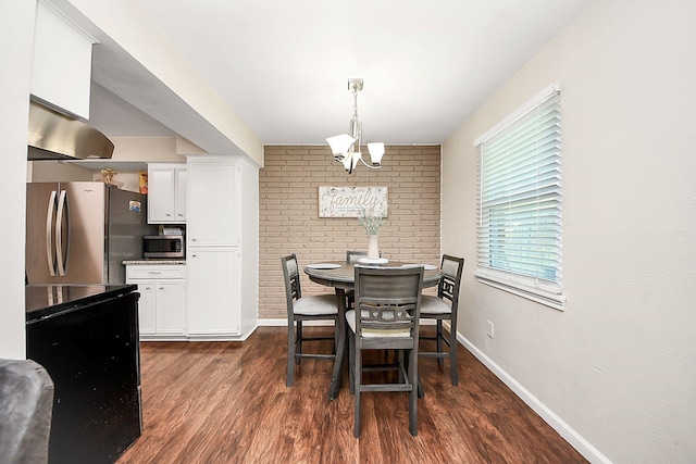 dining space featuring dark wood-style floors, baseboards, and a chandelier