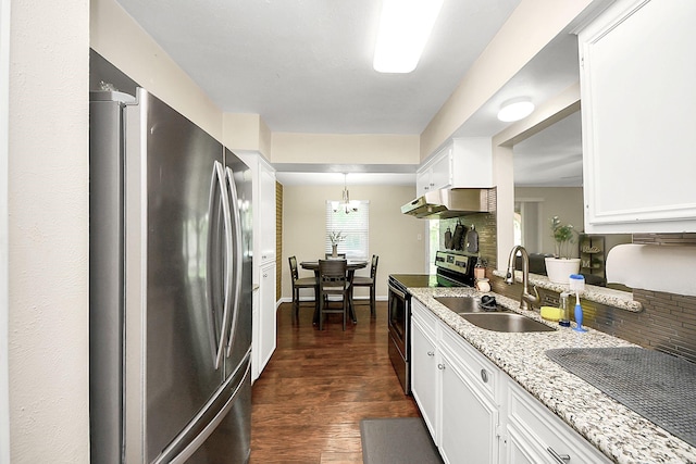 kitchen featuring stainless steel appliances, a sink, under cabinet range hood, white cabinets, and dark wood-style flooring