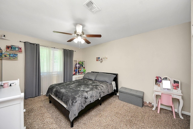 bedroom featuring light colored carpet, a ceiling fan, and baseboards