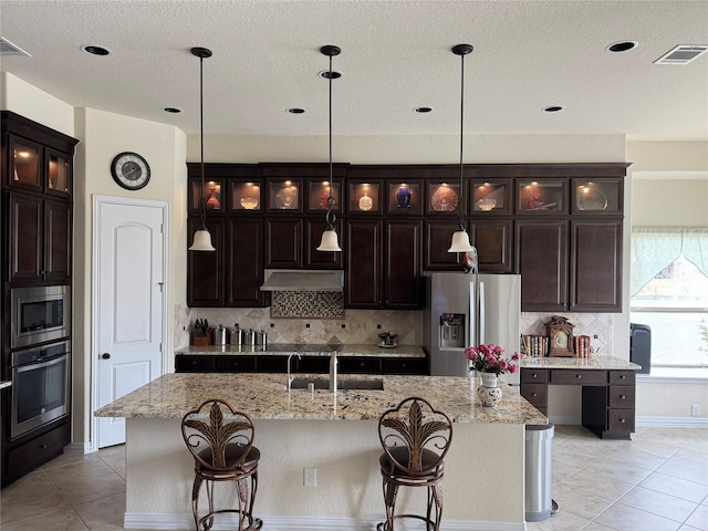 24130 Cannon Anello Ct, Katy, TX 77493 - kitchen featuring stainless steel appliances, light tile patterned flooring, a sink, backsplash, and recessed lighting