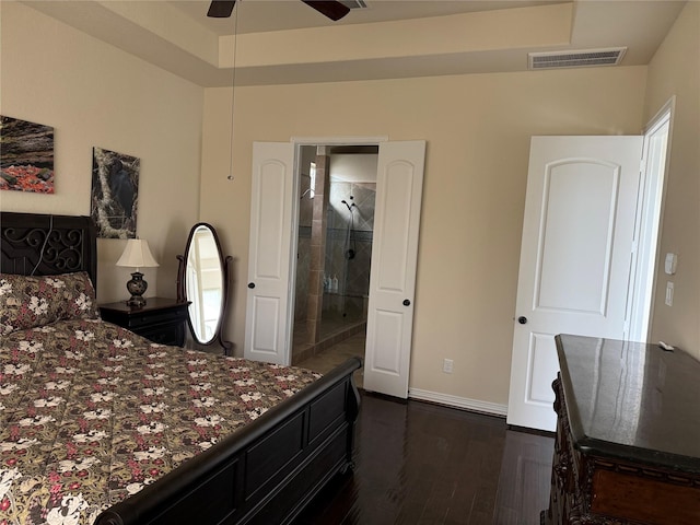 24130 Cannon Anello Ct, Katy, TX 77493 - bedroom with dark wood-style flooring, ensuite bath, and baseboards