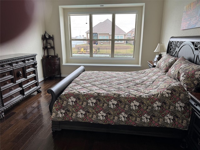 24130 Cannon Anello Ct, Katy, TX 77493 - bedroom featuring dark wood-type flooring and baseboards