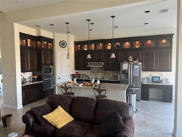 24130 Cannon Anello Ct, Katy, TX 77493 - kitchen featuring appliances with stainless steel finishes, tasteful backsplash, light tile patterned floors, glass insert cabinets, and open floor plan