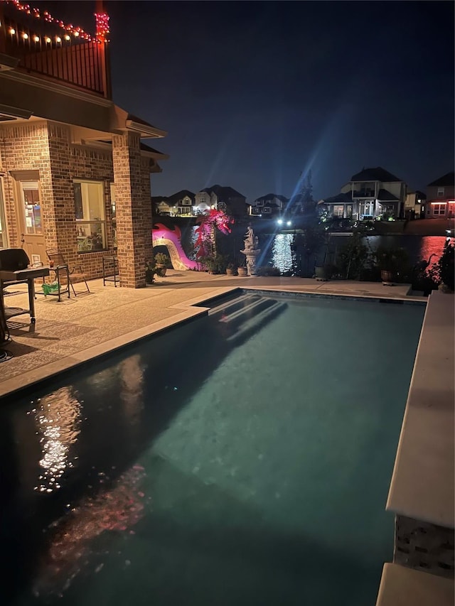 24130 Cannon Anello Ct, Katy, TX 77493 - pool at twilight featuring an outdoor pool