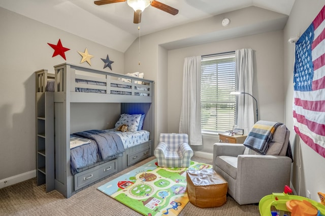carpeted bedroom with lofted ceiling, baseboards, and a ceiling fan