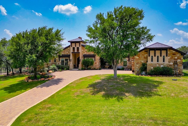 143 Westgate Loop, Horseshoe Bay, TX 78657 - view of front facade featuring stone siding and a front yard