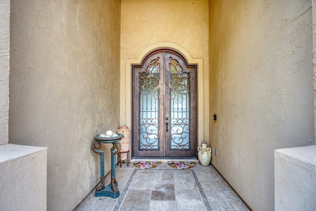 143 Westgate Loop, Horseshoe Bay, TX 78657 - property entrance featuring stucco siding and french doors