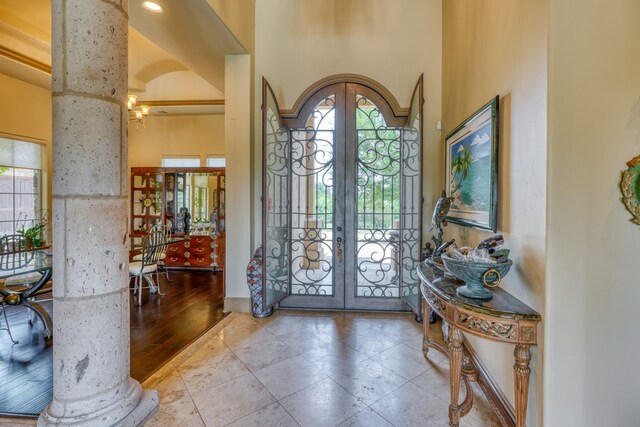 143 Westgate Loop, Horseshoe Bay, TX 78657 - foyer featuring french doors, decorative columns, and baseboards