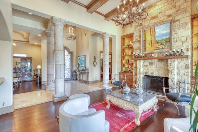 143 Westgate Loop, Horseshoe Bay, TX 78657 - living room featuring decorative columns, healthy amount of natural light, wood-type flooring, a towering ceiling, and beam ceiling
