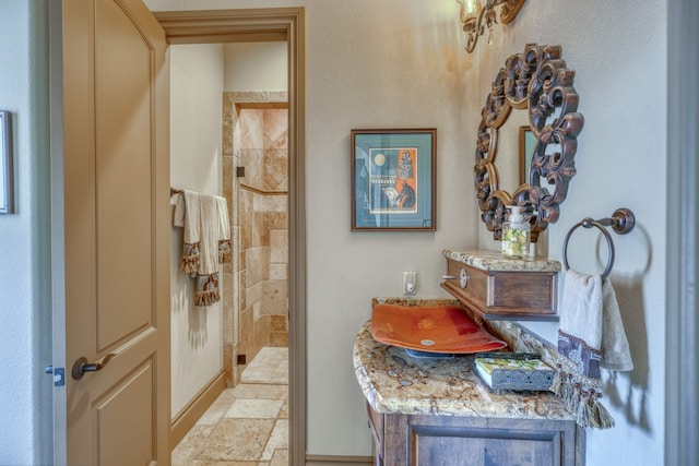 143 Westgate Loop, Horseshoe Bay, TX 78657 - bathroom featuring a shower stall and stone tile floors