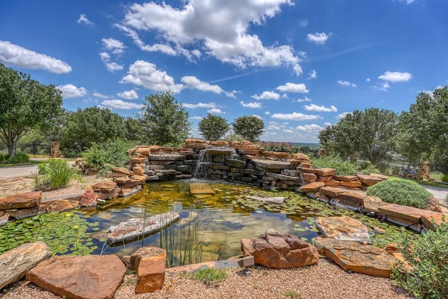 143 Westgate Loop, Horseshoe Bay, TX 78657 - view of yard with a small pond