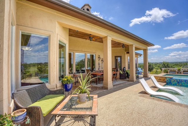 143 Westgate Loop, Horseshoe Bay, TX 78657 - view of patio / terrace featuring outdoor dining space, a ceiling fan, and a pool with connected hot tub
