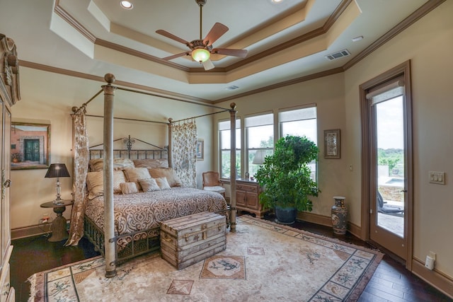 143 Westgate Loop, Horseshoe Bay, TX 78657 - bedroom featuring ornamental molding, access to exterior, a raised ceiling, baseboards, and hardwood / wood-style floors