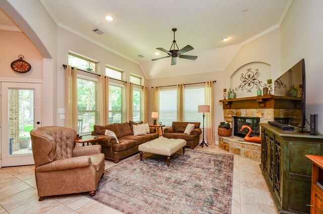 1523 Cafe Dumonde, Conroe, TX 77304 - living room featuring a ceiling fan, ornamental molding, a stone fireplace, arched walkways, and lofted ceiling