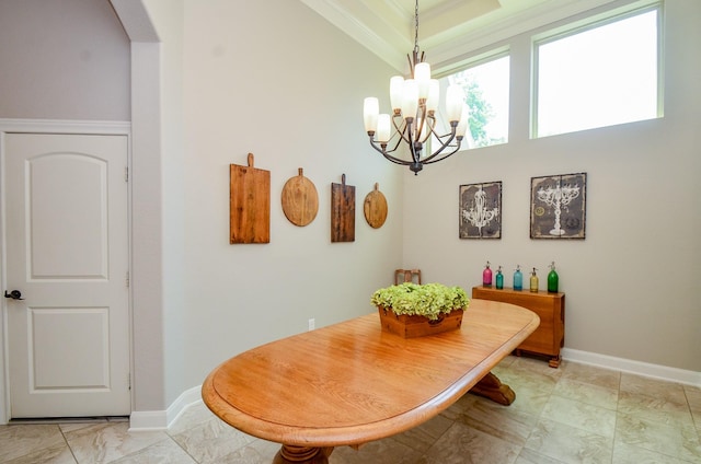 1523 Cafe Dumonde, Conroe, TX 77304 - dining room featuring a chandelier, baseboards, ornamental molding, and arched walkways
