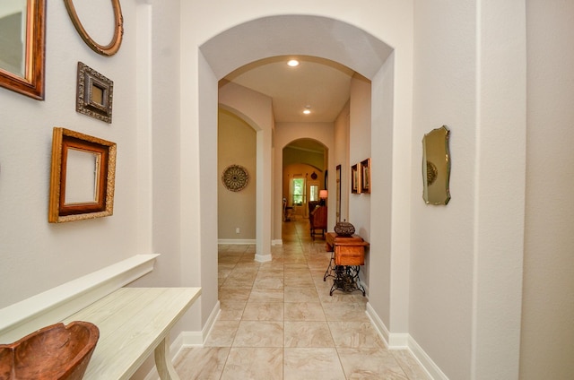 1523 Cafe Dumonde, Conroe, TX 77304 - hallway featuring arched walkways, recessed lighting, and baseboards