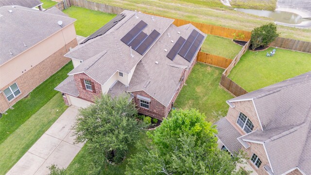 aerial view of property and surrounding area with a large body of water