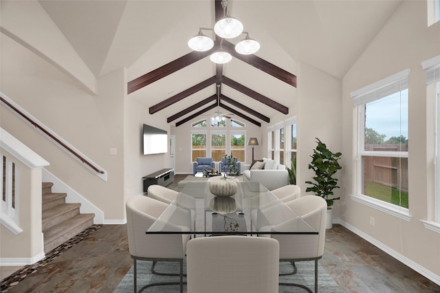 dining space with baseboards, beamed ceiling, stone tile flooring, stairs, and high vaulted ceiling