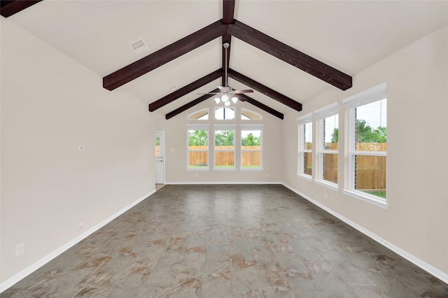 unfurnished living room featuring a ceiling fan and baseboards