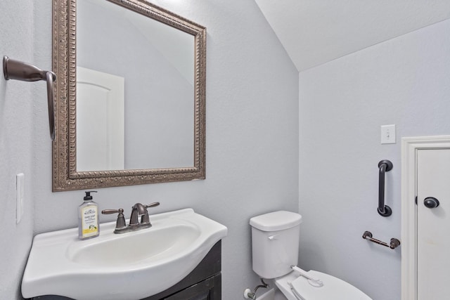 19107 Egret Glen Ct, Cypress, TX 77429 - half bathroom featuring toilet, lofted ceiling, and vanity