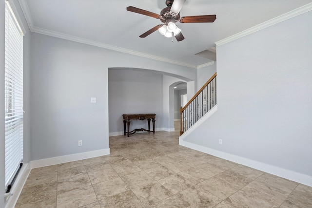 19107 Egret Glen Ct, Cypress, TX 77429 - spare room featuring arched walkways, a ceiling fan, crown molding, baseboards, and stairs