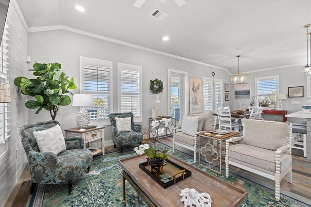 13731 Mutiny Ln, Galveston, TX 77554 - living room featuring wood finished floors, ornamental molding, recessed lighting, a ceiling fan, and baseboards