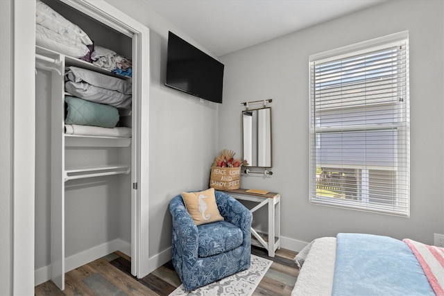 13731 Mutiny Ln, Galveston, TX 77554 - bedroom with baseboards and wood finished floors