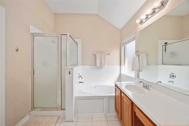 14402 Eastern Redbud Ln, Houston, TX 77044 - bathroom featuring a stall shower, a tub with jets, vaulted ceiling, vanity, and tile patterned floors