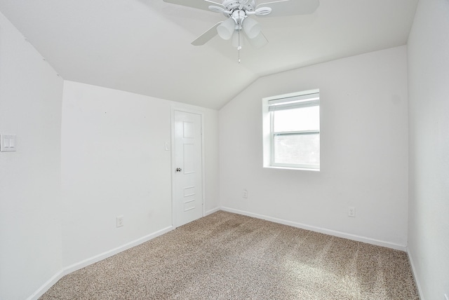 1049 Misty Clf, Dickinson, TX 77539 - spare room with vaulted ceiling, carpet flooring, a ceiling fan, and baseboards